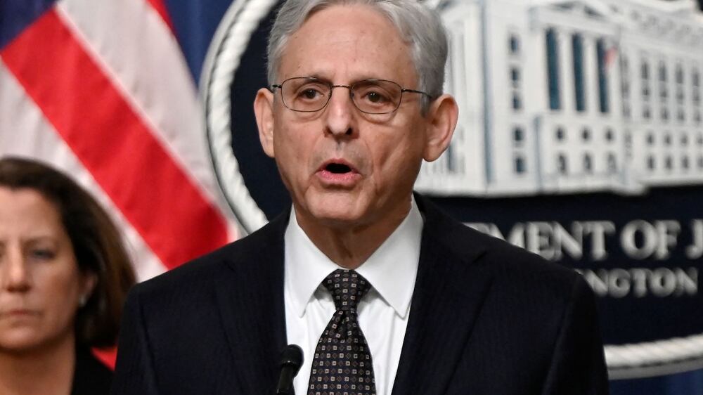 US Attorney General Merrick Garland, with Deputy Attorney General Lisa Monaco (L), speaks during a press conference at the Justice Department in Washington, DC, on January 27, 2023.  - Garland announced the arrests of three people who allegedly took part in a Tehran-backed plot to assassinate dissident Iranian journalist Masih Alinejad.  Two of those arrested were members of an Eastern European organized crime group with ties to Iran who were recruited to arrange Alinejad's murder in New York, said Garland.  (Photo by OLIVIER DOULIERY  /  AFP)