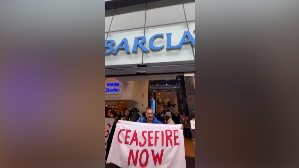 Palestine protesters storm Barclays Bank in Manchester