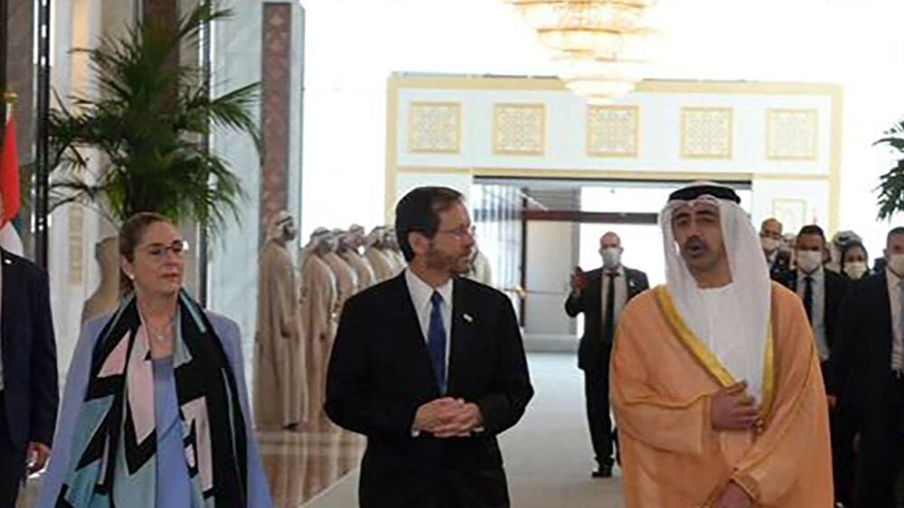 A handout picture obtained from the Israeli Government Press Office (GPO) shows the United Arab Emirates' Foreign Minister Sheikh Abdullah bin Zayed Al-Nahyan (R) welcoming Israel's President Isaac Herzog and First Lady Michal upon their arrival in the Emirati capital Abu Dhabi on January 30, 2022.  - This is the first Israeli presidential visit to the UAE since diplomatic relations were established between the two countries in 2020.  The UAE signed a landmark US-brokered deal in September 2020 to formalise relations with Israel, in the first such agreement by a Gulf Arab state and only the third by any Arab country, before Bahrain followed suit and then Morocco.  (Photo by Amos Ben GERSHOM  /  GPO  /  AFP)  /  - Israel OUT  /  RESTRICTED TO EDITORIAL USE - MANDATORY CREDIT "AFP PHOTO  /   BYLINE  /  SOURCE " - NO MARKETING - NO ADVERTISING CAMPAIGNS - DISTRIBUTED AS A SERVICE TO CLIENTS