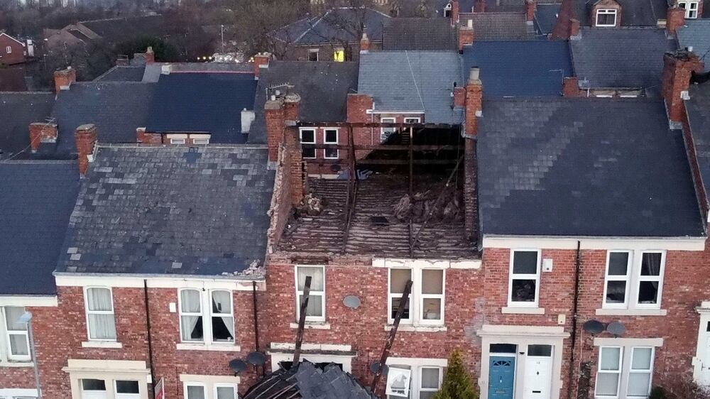 A house in Gateshead, north east England, Sunday Jan.  30, 2022, which lost its roof after strong winds from Storm Malik battered northern parts of the UK PA Photo.  The Met Office have said that another blast of severe strong winds is set to hit parts of the UK.  (Owen Humphreys / PA via AP)