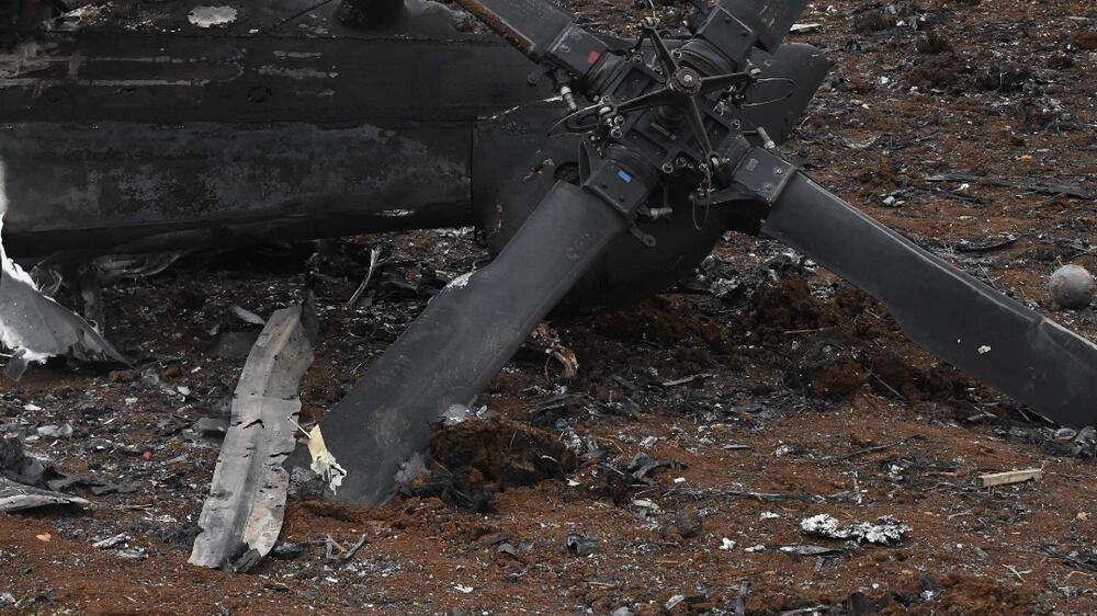 EDITORS NOTE: Graphic content / A picture taken on February 3, 2022 in the village of Jindayris in the Afrin region of Syria's rebel-hel northern Aleppo province shows the remains of a US helicopter following an overnight raid by US special operations forces against suspected jihadists in the Syrian norwestern province of Idlib.  (Photo by Rami al SAYED  /  AFP)