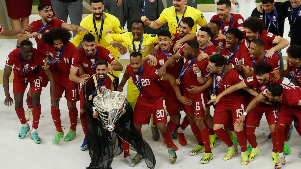 Asian Cup champions Qatar parade trophy to delight fans