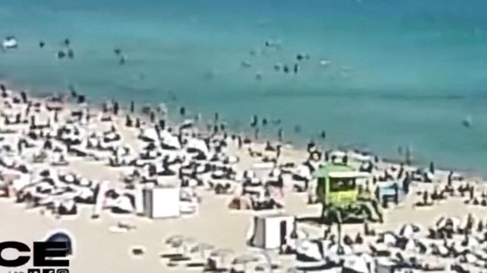 Helicopter crashes metres from bathers on crowded beach in Miami