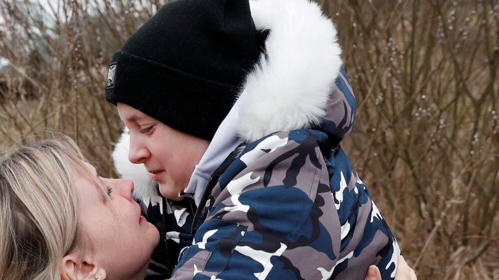 Mother reunited with children after father forced to stay in Ukraine
