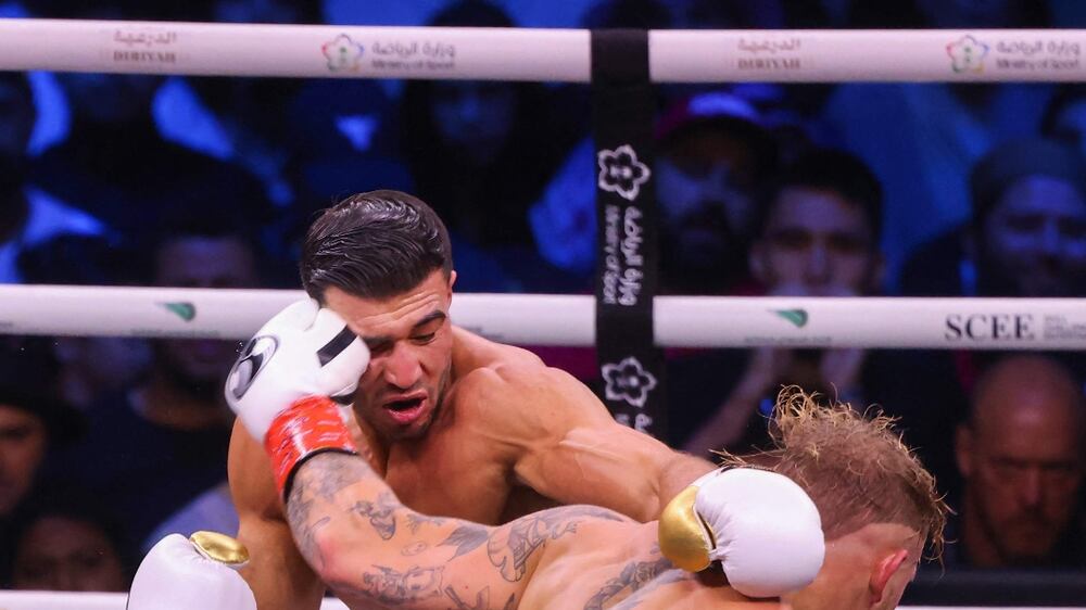 British reality TV star Tommy Fury (L) fights against US YouTuber Jake Paul during a boxing match held at Diriyah in Riyadh on February 27, 2023.  (Photo by Fayez Nureldine  /  AFP)