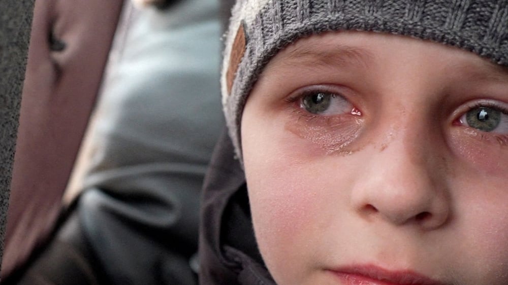 We left Dad in Kiev, says tearful Ukrainian boy