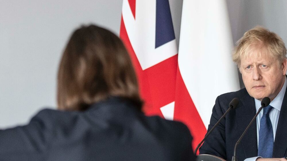 WARSAW, POLAND - MARCH 01: British Prime Minister Boris Johnson takes a question from Ukrainian journalist Daria Kaleniuk about the no fly zone as he gives a press conference at the embassy on March 1, 2022 in Warsaw, Poland. Johnson is travelling to Poland to meet with Polish Prime Minister Mateusz Morawiecki.(Photo by Richard Pohle-Pool / Getty Images)