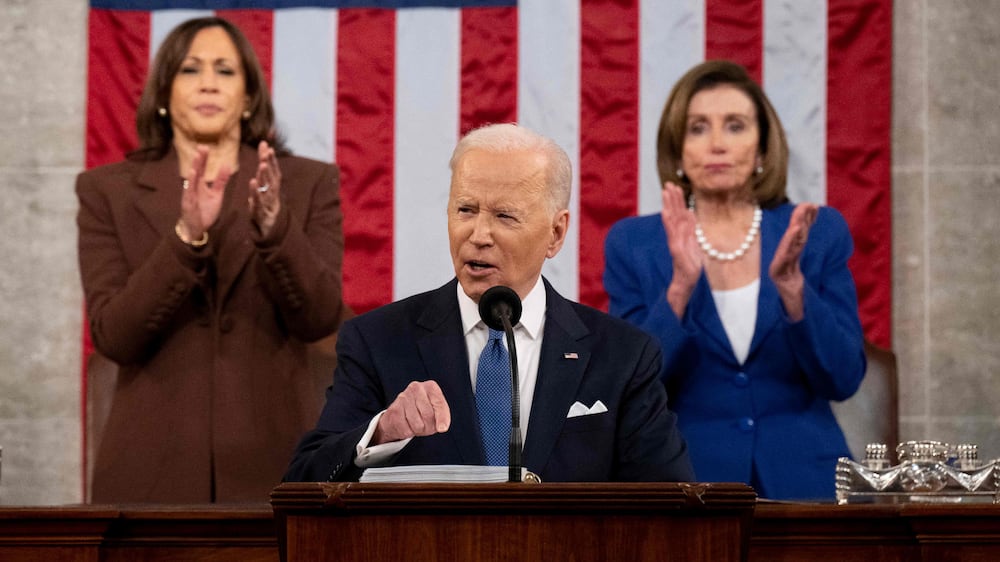 US Vice President Kamala Harris (L) and US House Speaker Nancy Pelosi (D-CA) applaud US President Joe Biden as he delivers his first State of the Union address at the US Capitol in Washington, DC, on March 1, 2022.  (Photo by SAUL LOEB  /  POOL  /  AFP)