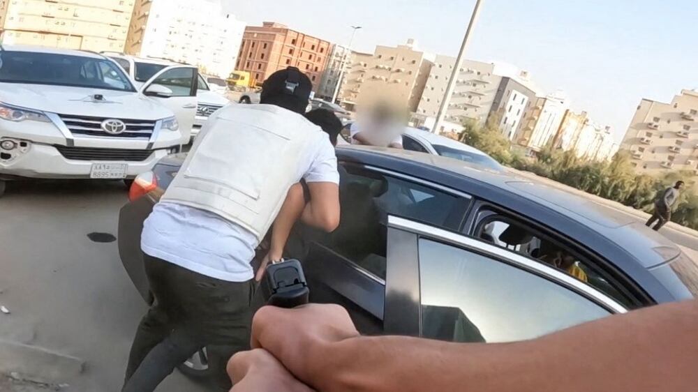 This image grab from a handout video made available by the Saudi Ministry of Interior on March 1, 2022 shows Saudi anti-narcotics agents arresting Captagon smugglers during a special operation in Tayseer district of eastern Jeddah.  - According to the UN Office on Drugs and Crime, Captagon has been manufactured mostly in Lebanon and Syria, where it fuelled jihadist fighters.  Much of it is bound for Saudi Arabia.  The country of 35 million, more than half of whom are under the age of 35, is witnessing unprecedented social change and has long suffered from drugs.  (Photo by Saudi Ministry of Interior  /  AFP)  /  RESTRICTED TO EDITORIAL USE - MANDATORY CREDIT "AFP PHOTO /  SAUDI INTERIOR MINISTRY" - NO MARKETING - NO ADVERTISING CAMPAIGNS - DISTRIBUTED AS A SERVICE TO CLIENTS