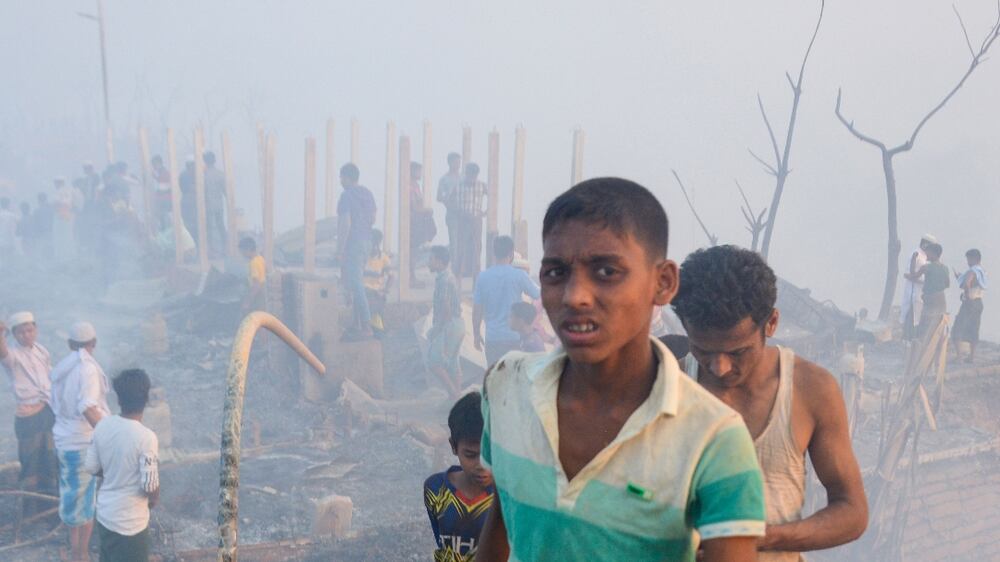 Rohingya refugees search for their belongings after a fire broke out in Balukhali refugee camp in Ukhia, Coxâ€™s bazar, Bangladesh, 05 March 2023.  According to the United Nations High Commissioner for Refugees (UNHCR) report, over 90 facilities including hospitals and learning centres were damaged as a massive fire broke out at a Rohingya camp in Cox's Bazar's Ukhiya upazila on 05 March afternoon.   EPA / STR