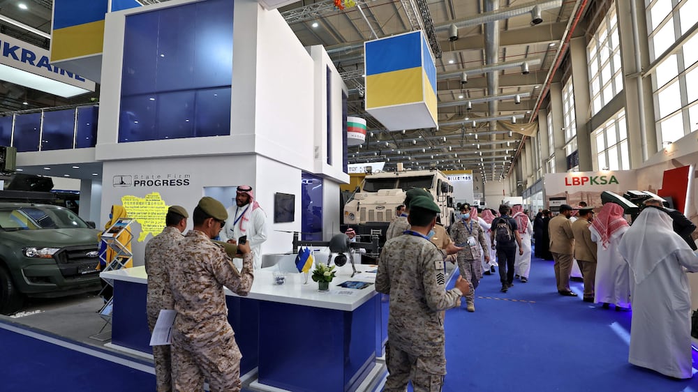 Saudis check the Ukrainian military stand during Saudi Arabia’s first World Defense Show, north of the capital Riyadh, on March 8, 2022.  (Photo by Fayez Nureldine  /  AFP)