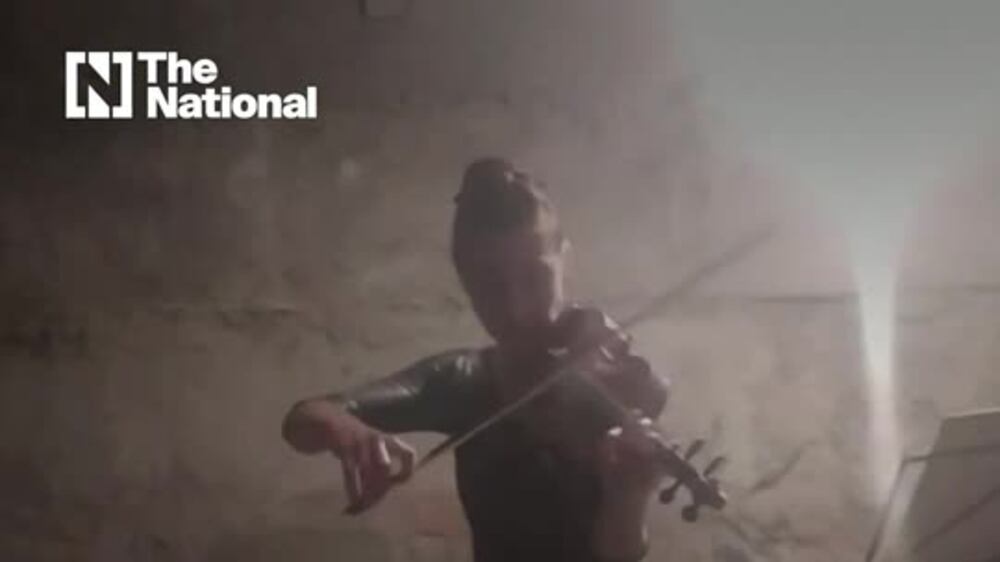 Violinist plays in bomb shelter