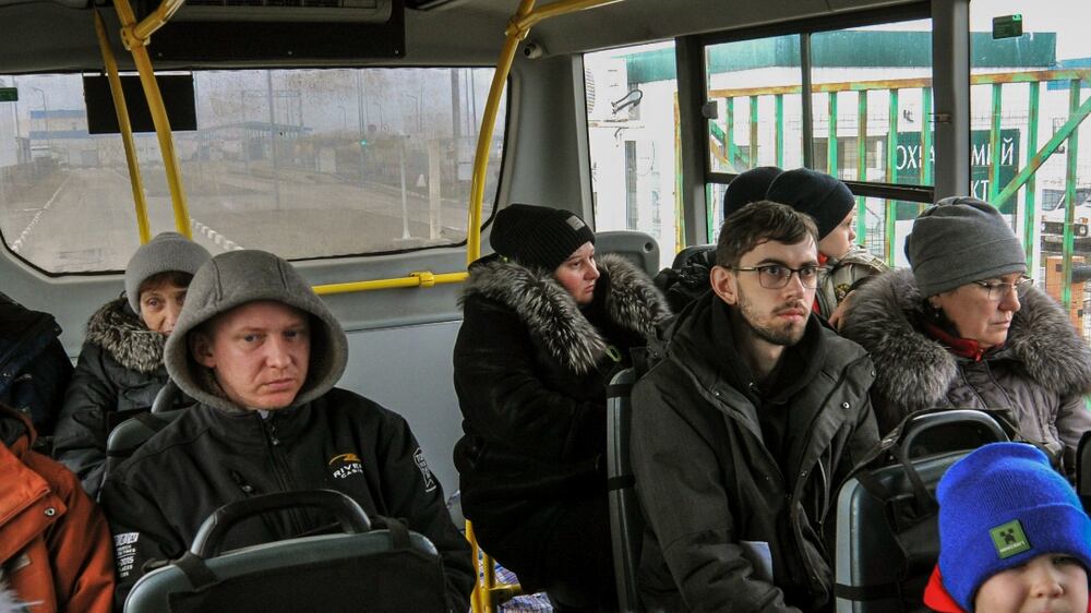 Ukrainians in captured towns around Kyiv escape through corridors