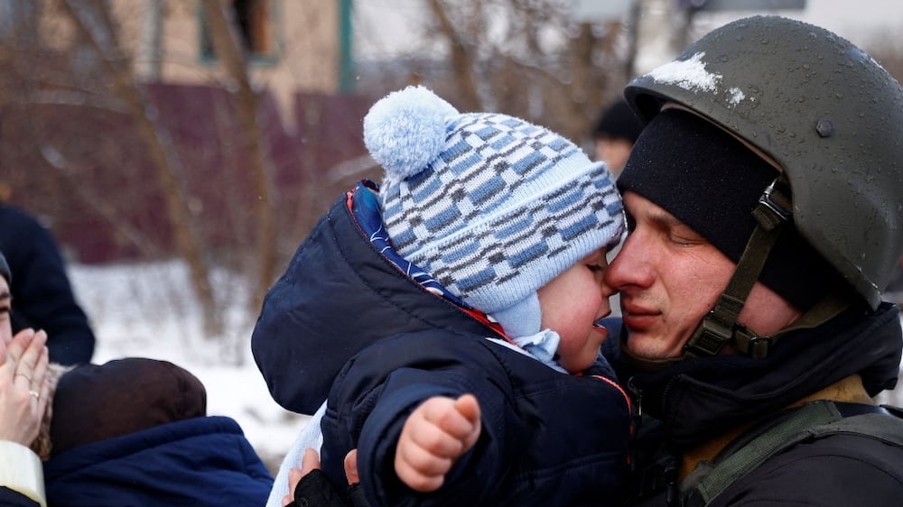 Ukrainian policeman says a heartbreaking goodbye to son