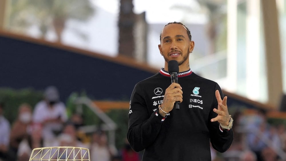 Mercedes' British F1 Driver Lewis Hamilton speaks at Expo Dubai 2020 in the Gulf emirate on March 14, 2022.  (Photo by Karim SAHIB  /  AFP)