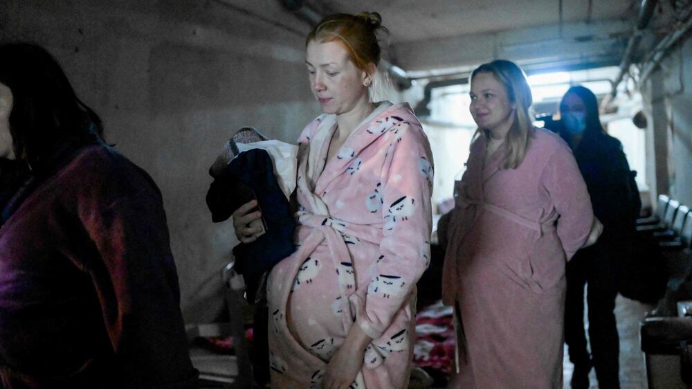 Ukrainian women wait to give birth in maternity hospital basement