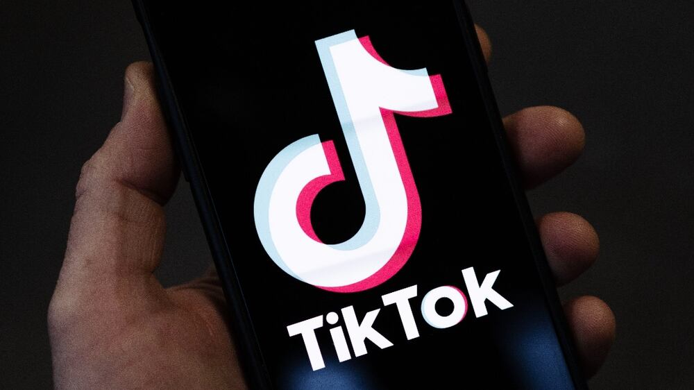 LONDON, ENGLAND - FEBRUARY 28: In this photo illustration, a TikTok logo is displayed on an iPhone on February 28, 2023 in London, England. This week, the US government and European Union's parliament have announced bans on installing the popular social media app on staff devices. (Photo by Dan Kitwood / Getty Images)