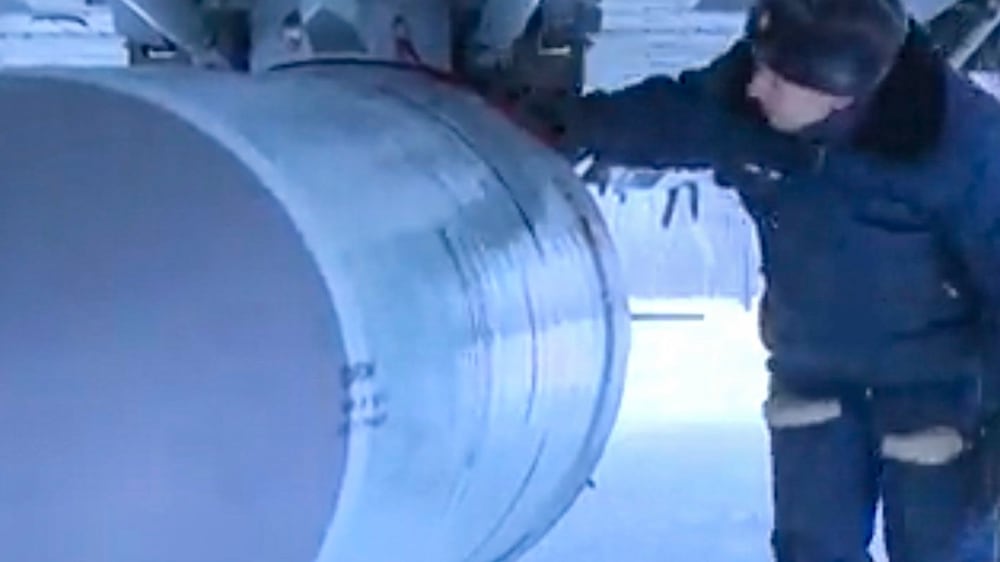 A handout still image taken from handout video made available by the Russian Defence ministry press-service shows Russian servicemen examines a Kinzhal hypersonic missiles before a flight of the MiG-31K fighter jet during the Russian strategic deterrence forces exercises in Russia, 19 February 2022.  Russian President Vladimir Putin opens exercises of the Russian strategic deterrence forces with launches of the ballistic missiles.  Russian Navy ships of the Northern and Black Sea Fleets launched 'Kalibr' cruise missiles and 'Zirkon' hypersonic missiles at sea and ground targets during scheduled exercises of the strategic deterrence forces on Saturday.  The 'Yars' intercontinental ballistic missile was launched from Plesetsk at the Kura training ground.   EPA / RUSSIAN DEFENCE MINISTRY PRESS SERVICE  /  HANDOUT  HANDOUT EDITORIAL USE ONLY / NO SALES
