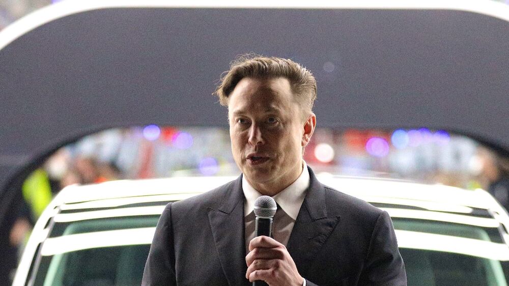 Watch Elon Musk dance as he hands over new German-made Teslas