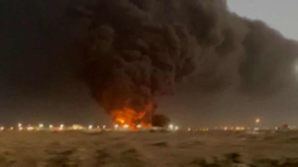 Smoke billows from an oil storage facility in Saudi Arabia's Red Sea coastal city of Jeddah on March 25, 2022.  - Yemeni rebels said they attacked a Saudi Aramco oil facility in Jeddah as part of a wave of drone and missile assaults today as a huge cloud of smoke was seen near the Formula One venue in the city.  (Photo by ANDREJ ISAKOVIC  /  AFP)