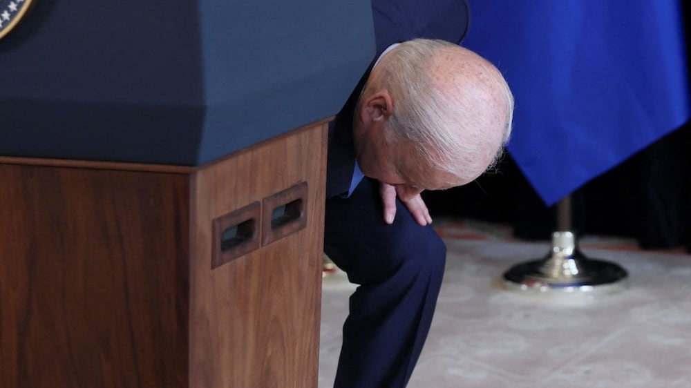 Joe Biden jokes as he struggles to pull out a stool