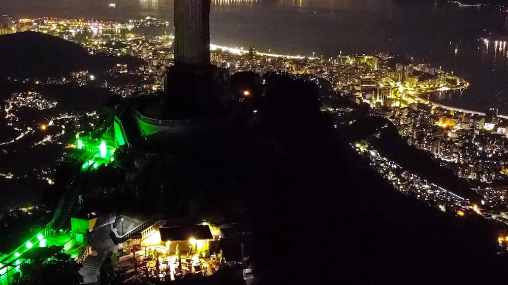 An aerial image taken by a drone shows an unlit Christ the Redeemer statue, in Rio de Janeiro, Brazil, 25 March 2023.  The famous monument had its lights shut off in support of Earth Hour 2023, organized by the World Wildlife Fund (WWF), with the goal of bringing attention to the climatic crisis.   EPA / Andre Coelho
