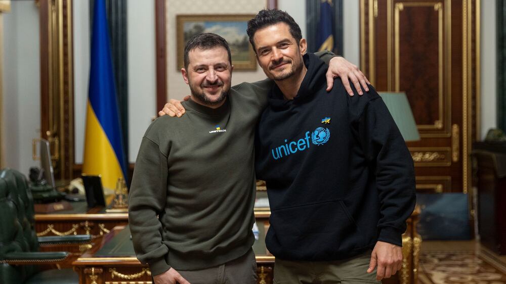 In this photo provided by the Ukrainian Presidential Press Office, Ukrainian President Volodymyr Zelenskyy, left, poses for photo with British actor and UNICEF Goodwill Ambassador Orlando Bloom during their meeting in Kyiv, Ukraine, Sunday, March 26, 2023.  (Ukrainian Presidential Press Office via AP)