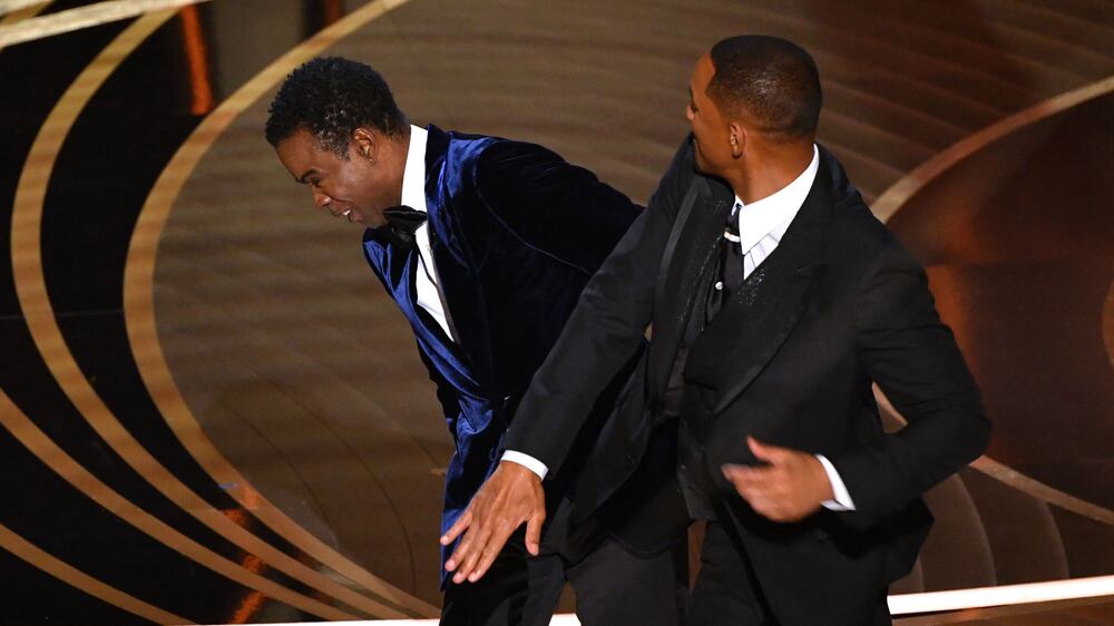 US actor Will Smith (R) slaps US actor Chris Rock onstage during the 94th Oscars at the Dolby Theatre in Hollywood, California on March 27, 2022.  (Photo by Robyn Beck  /  AFP)