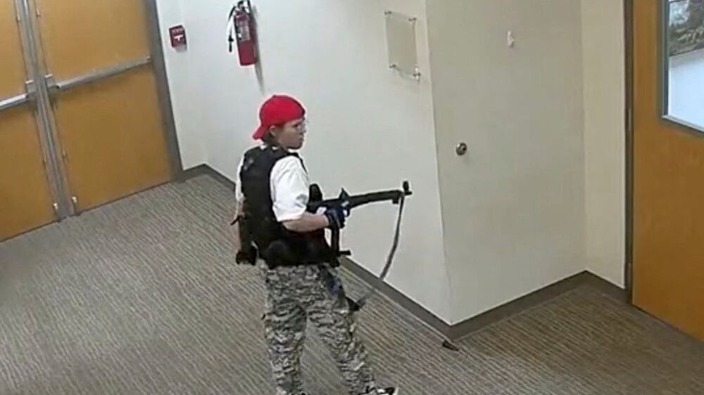 A still image from surveillance video shows what the Metropolitan Nashville Police Department describe as mass shooting suspect Audrey Elizabeth Hale, 28, entering The Covenant School carrying weapons in Nashville, Tennessee, U. S.  March 27, 2023.   Metropolitan Nashville Police Department/Handout via REUTERS   THIS IMAGE HAS BEEN SUPPLIED BY A THIRD PARTY.  NO RESALES.  NO ARCHIVES