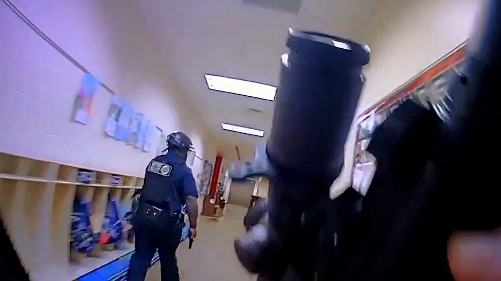 Metropolitan Nashville Police Department officers search for the mass shooting suspect in The Covenenant School, in a still image from body camera video in Nashville, Tennessee, U. S.  March 27, 2023.   Metropolitan Nashville Police Department/Handout via REUTERS.   THIS IMAGE HAS BEEN SUPPLIED BY A THIRD PARTY. 