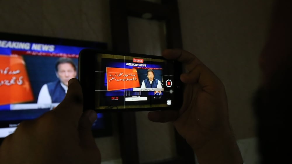 People watch a televised speech by the Prime Minister Imran Khan as he announce dissolving the national assembly (lower house of the parliament), in Islamabad, Pakistan, 03 April 2022.  On the advise of Prime Minister Imran Khan, Pakistan's President, Dr.  Arif Alvi, has approved the dissolution of the national assembly paving the way for general elections in 3 months.  According to Khan, there has been unacceptable meddling in Pakistan's democratic institutions, and a transitional government should be formed to organise new elections.   EPA / BILAWAL ARBAB