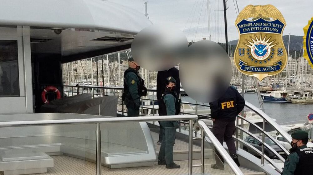 In this handout image released by Spanish Guardia Civil on April 4, 2022, Spanish civil guards and US agents of Homeland Security Investigations (HSI) and the Federal Bureau of Investigation (FBI) search a yacht owned by Russian billionaire Viktor Vekselberg in Palma de Mallorca.  - Authorities seized on April 4, 2022 a mega yacht in Spain owned by an oligarch with close ties to Russian President Vladimir Putin at the demand of the United States, Spanish police said.  The 78-meter-long yacht named Tango was impounded at the Mediterranean port of Palma de Mallorca by Spanish police in coordination with US federal agents, Spain's Guardia Civil police force said in a statement.  (Photo by Handout  /  Spanish Guardia Civil  /  AFP)  /  RESTRICTED TO EDITORIAL USE - MANDATORY CREDIT "AFP PHOTO  /  GUARDIA CIVIL  /  HANDOUT" - NO MARKETING - NO ADVERTISING CAMPAIGNS - DISTRIBUTED AS A SERVICE TO CLIENTS