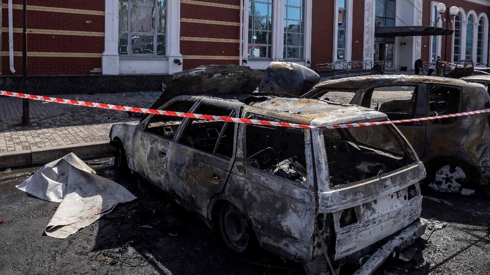 Calcinated cars are pictured outside a train station in Kramatorsk, eastern Ukraine, that was being used for civilian evacuations, after it was hit by a rocket attack killing at least 35 people, on April 8, 2022.  (Photo by FADEL SENNA  /  AFP)