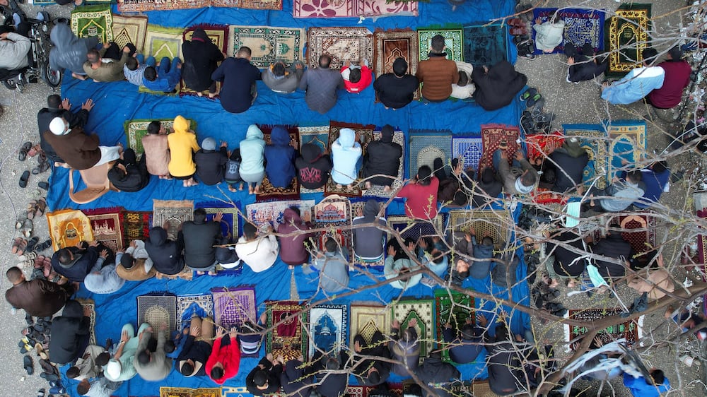 Gaza residents hold Eid prayers by ruins of mosque