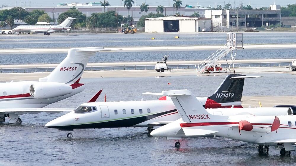 Small planes are parked at Fort Lauderdale- Hollywood International Airport, after the airport was force to shut down due to flooding, Thursday, April 13, 2023, in Fort Lauderdale, Fla.  Fort Lauderdale issued a state of emergency as flood conditions continued through many areas.  Over 25 inches of rain fell in South Florida since Monday causing widespread flooding.  (AP Photo / Marta Lavandier)