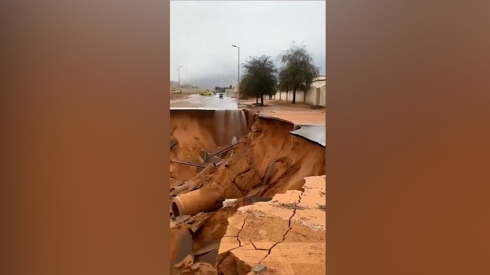Road in Al Ain collapses as rain and hail lash UAE