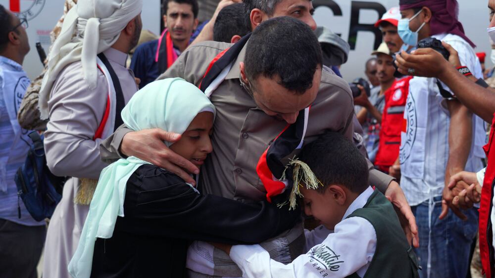 Abdelkhaleq Amran, a freed Yemeni journalist who was sentenced to death by the Houthis, meets his children upon his arrival at an airport on the third day of a prisoner swap in the government-contorlled of Marib, Yemen, 16 April 2023.   Four Yemeni journalists, detained for more than seven years and sentenced to death by the Houthis, were released under the three-day exchange of 887 prisoners of war between Yemenâ€™s warring parties.  According to international organizations, the journalists were kidnapped in 2015 and sentenced to death by a Houthi-linked court five years later.  The Houthis have agreed to release 181 detainees, including Saudis and Sudanese soldiers who fought alongside Yemeni government forces, in exchange for 706 prisoners held by the Yemeni government, under the UN and ICRC-brokered prisoner swap deal reached last March in Switzerland.   EPA / HISHAM AL-HELALI