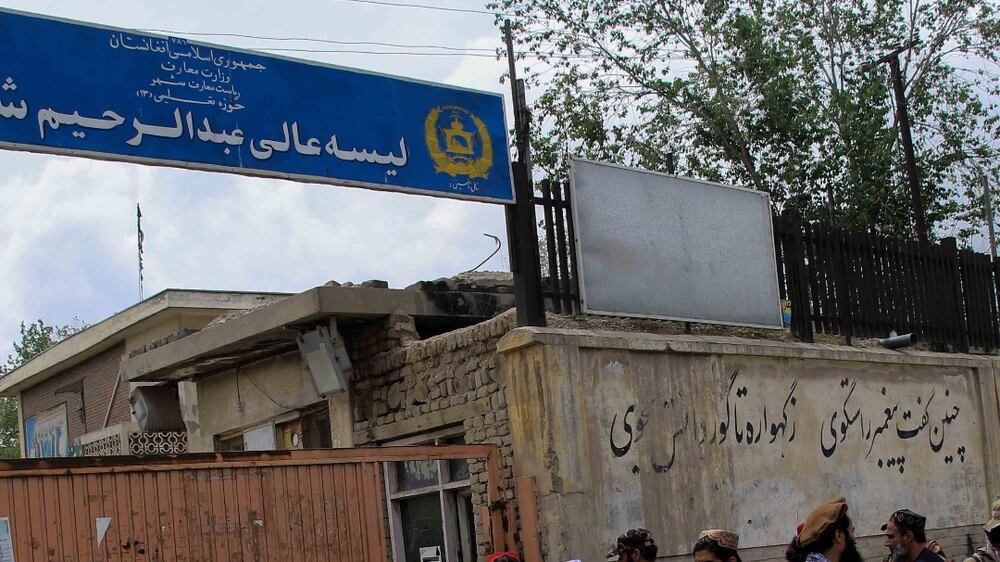 Taliban gather outside a school in the aftermath of multiple bomb blasts in a Shi'ite majority neighborhood, in Kabul, Afghanistan, 19 April 2022.  At least four people were killed and several others were injured in consecutive suspected suicide blasts.   EPA / STRINGER