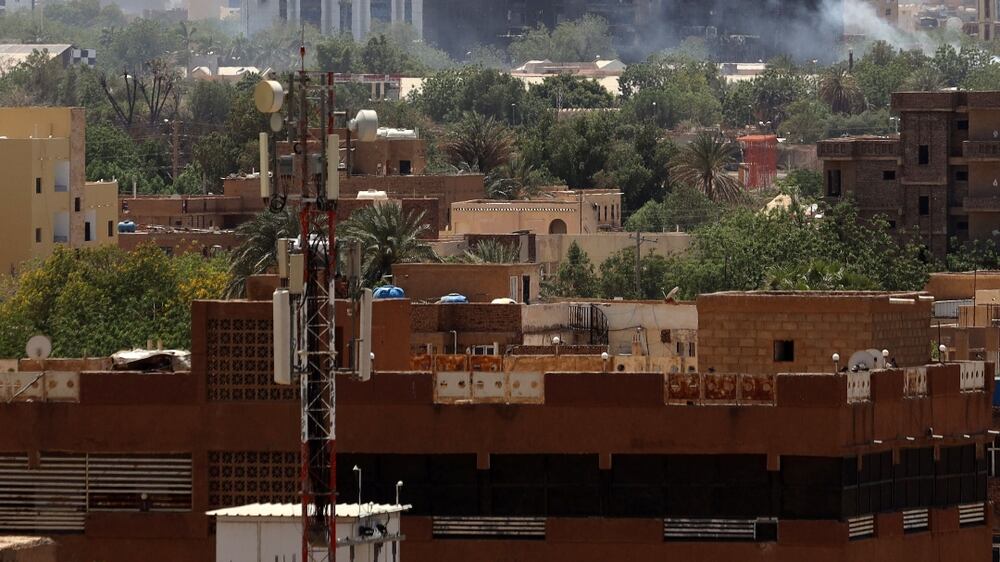 A civilian holds up an empty bullet case in front of a damaged window of a residential building during ongoing skirmish between Sudanese army and paramilitaries of the Rapid Support Forces (RSF) in Khartoum, Sudan, 18 April 2023.  A power struggle erupted 15 April between the Sudanese army led by army Chief General Abdel Fattah al-Burhan and the paramilitaries of the Rapid Support Forces (RSF) led by General Mohamed Hamdan Dagalo, resulting in at least 200 deaths according to doctors' association in Sudan.  The RSF on 18 April said it approved a 24-hour ceasefire to allow evacuation of the wounded, however the Sudanese army did not confirm the deal.   EPA / STRINGER