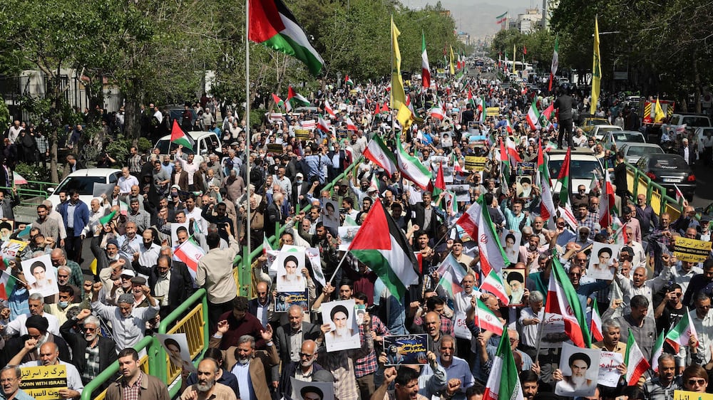 Iranians rally against Israel after suspect drone strike