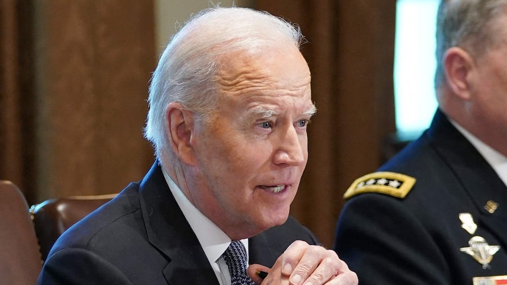 US President Joe Biden, flanked by Defense Secretary Lloyd Austin (L) and Chairman of the Joint Chiefs of Staff General Mark Milley, meets with the Joint Chiefs of Staff and Combatant Commanders in Cabinet Room of the White House in Washington, DC on April 20, 2022.  (Photo by MANDEL NGAN  /  AFP)