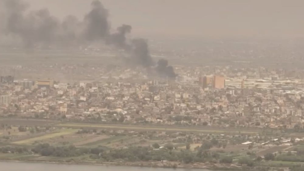 A drone view shows smoke rising over the Khartoum North Light Industrial Area, in Bahri, Sudan, April 23, 2023, in this still image taken from video obtained by Reuters.  Video obtained by Reuters /  via REUTERS