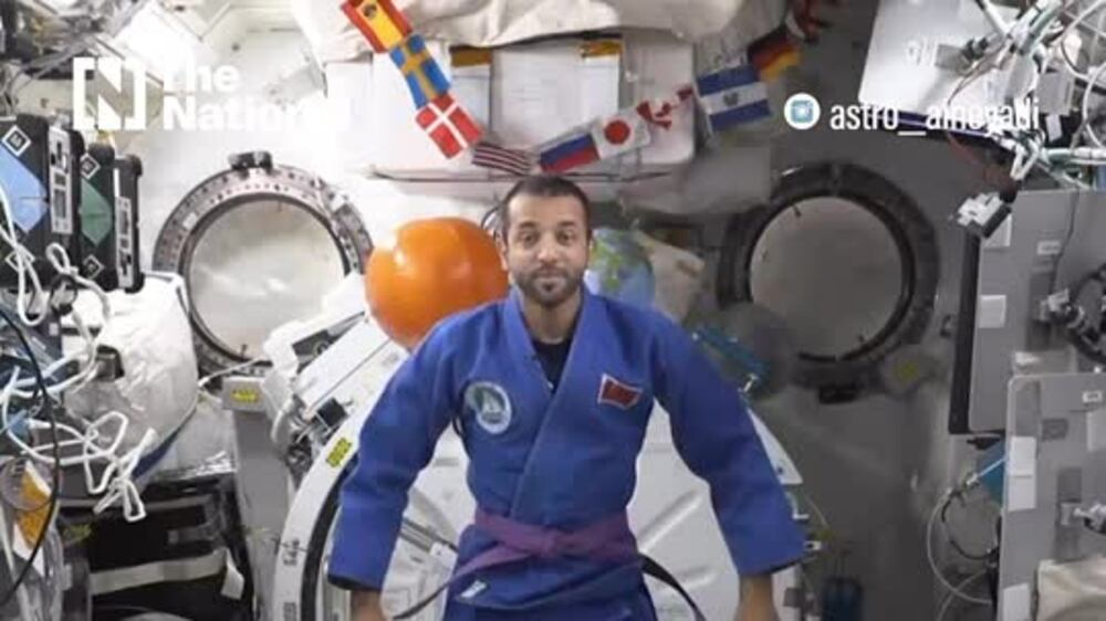 Sultan Al Neyadi wears jiu jitsu kimono in space