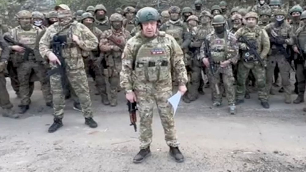 Founder of Wagner private mercenary group Yevgeny Prigozhin makes a statement as he stand next to Wagner fighters in an undisclosed location in the course of Russia-Ukraine conflict, in this still image taken from video released May 5, 2023.  Press service of "Concord"/Handout via REUTERS ATTENTION EDITORS - THIS IMAGE WAS PROVIDED BY A THIRD PARTY.  NO RESALES.  NO ARCHIVES.  MANDATORY CREDIT. 