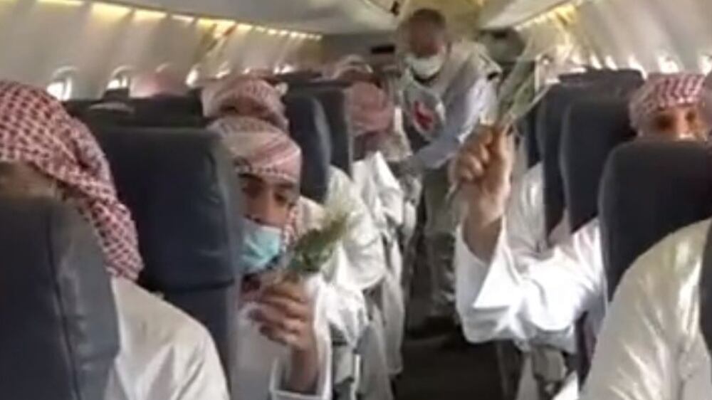 A screengrab of a vidoe showing released Houthi prisoners onboard the second plane that left saudi Arabia for Yemen. SPA