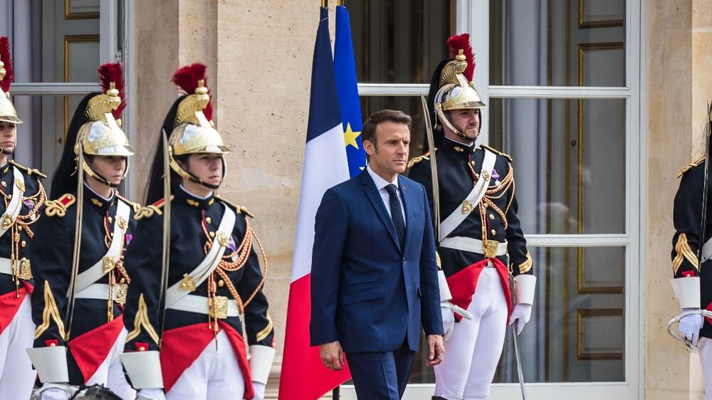 French President Emmanuel Macron (C) arrives to review troops as he attends a flag ceremony in the garden of the Elysee Palace as part of the inauguration ceremony in Paris, France, 07 May 2022.  Macron was sworn-in for a second term as president during a ceremony at the Elysee Palace after his re-election on 24 April 2022.   EPA / CHRISTOPHE PETIT TESSON