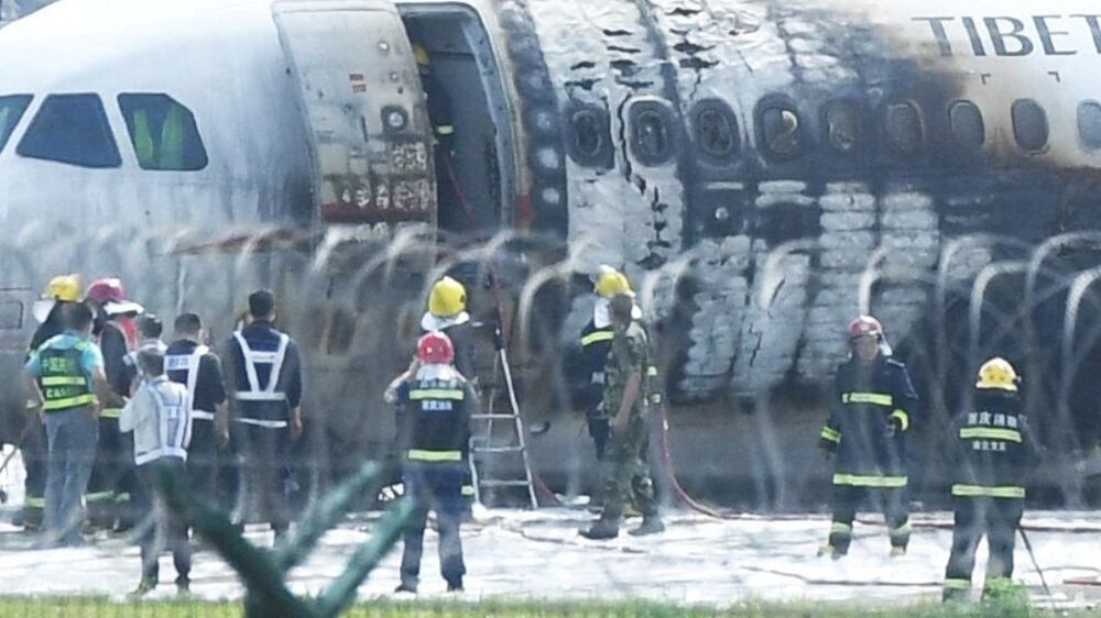 Passenger jet with 122 people on board catches fire in China