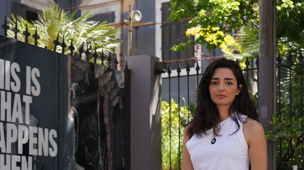 Lama Ramadan poses in front of a building in Beirut. (Finbar Anderson / The National)