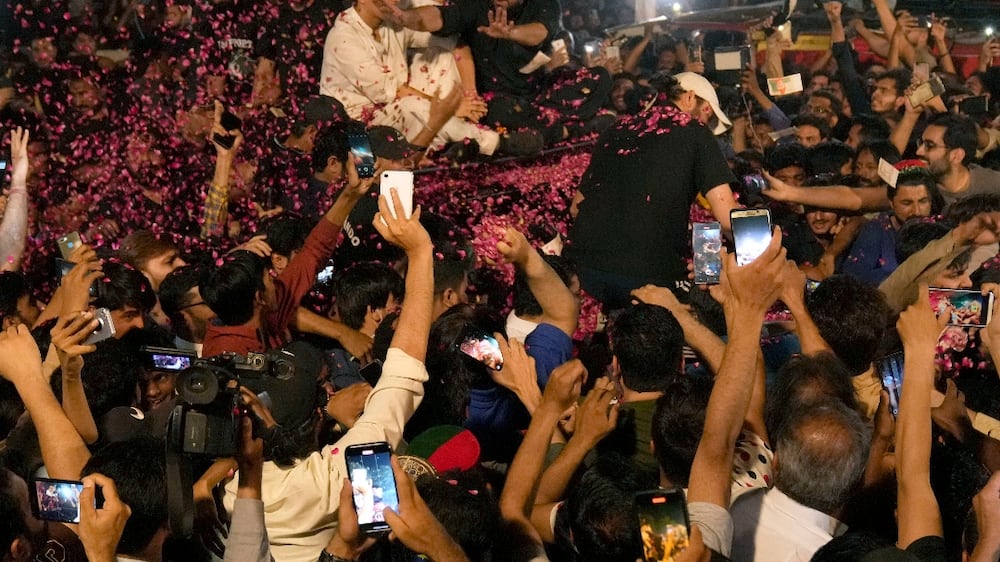 Supporters welcome Imran Khan home with rose petals