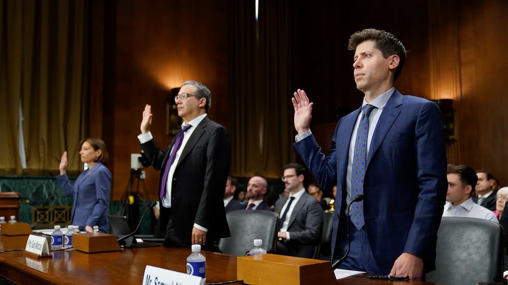 OpenAI CEO Sam Altman, from right, NYU Professor Emeritus Gary Marcus and IBM Chief Privacy and Trust Officer Christina Montgomery are sworn in before testifying at a Senate Judiciary Subcommittee on Privacy, Technology and the Law hearing on artificial intelligence, Tuesday, May 16, 2023, on Capitol Hill in Washington.  (AP Photo / Patrick Semansky)